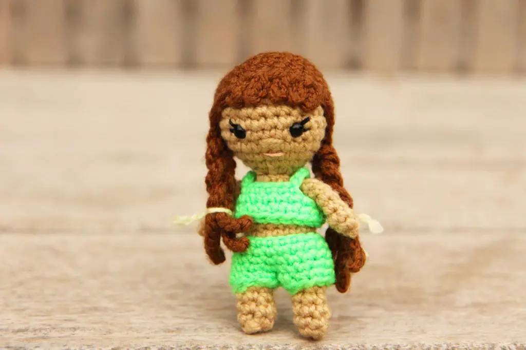 crochet doll with two long side braids and a tankini