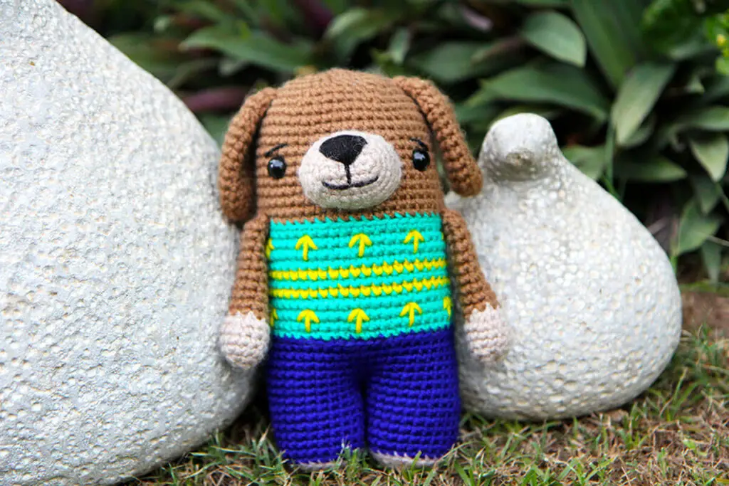 crochet dog with bands and a sweater