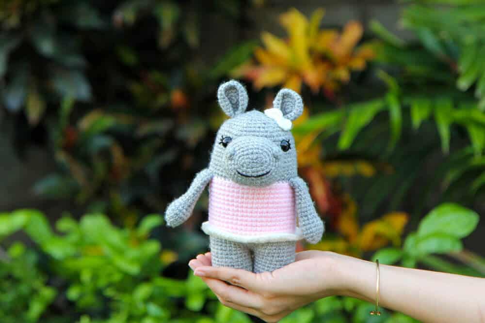 Crochet hippo with pink dress and bow