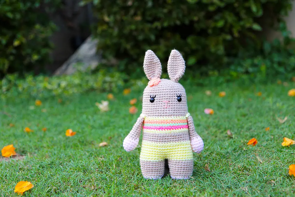 crochet bunny with a flower in her hair