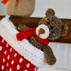 small crochet bear in a Christmas stocking