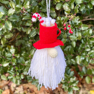 gnome crochet ornament with a hot cocoa hat with mashmallows and a candy cane