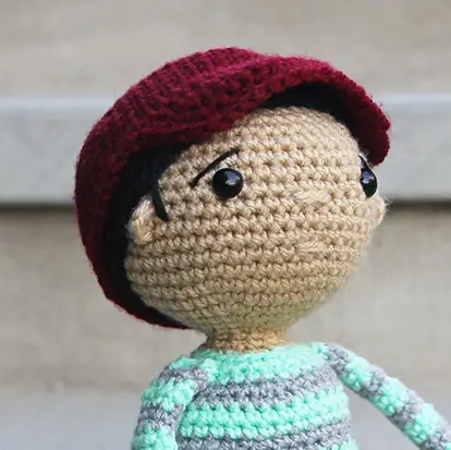 Zayd crochet doll closeup of facial embroidery