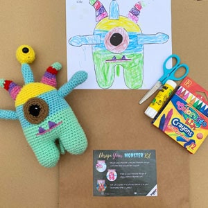 the contents of the design your own crochet monster kit