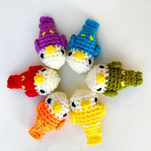 five colourful small crochet birds