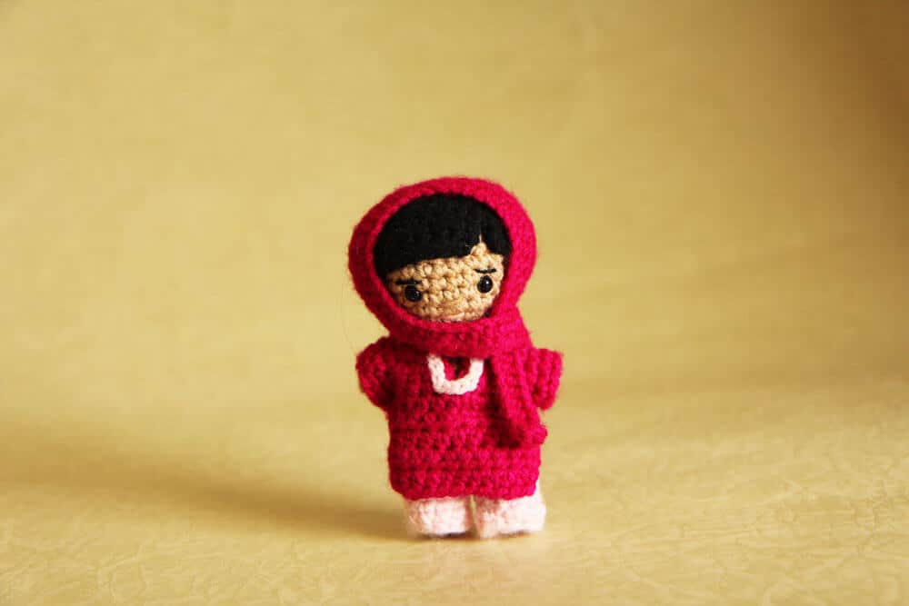 Malala crochet doll wearing a shalwar kurta