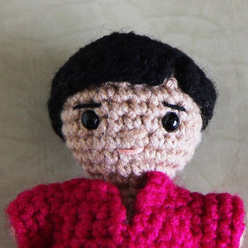 Crochet doll with a short hair cap with a side part