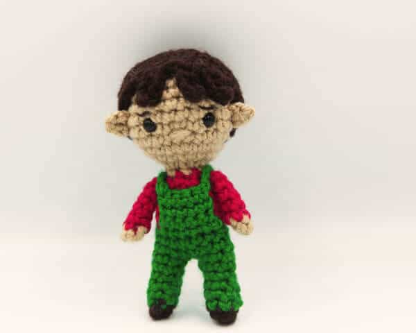 crochet boy doll in overalls with elf ears