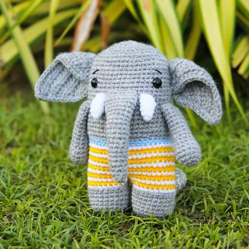 crochet elephant in striped swim shorts