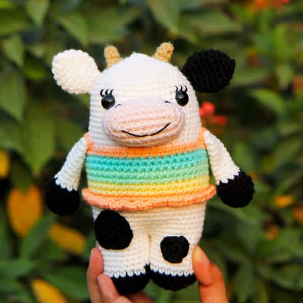 crocheted cow with striped tank top