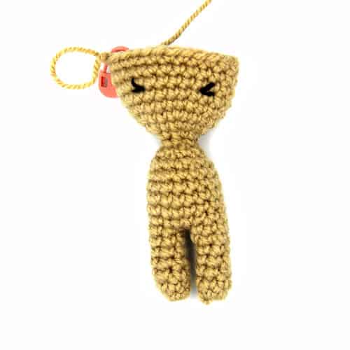 incomplete small crochet doll base with eyelashes embroidered