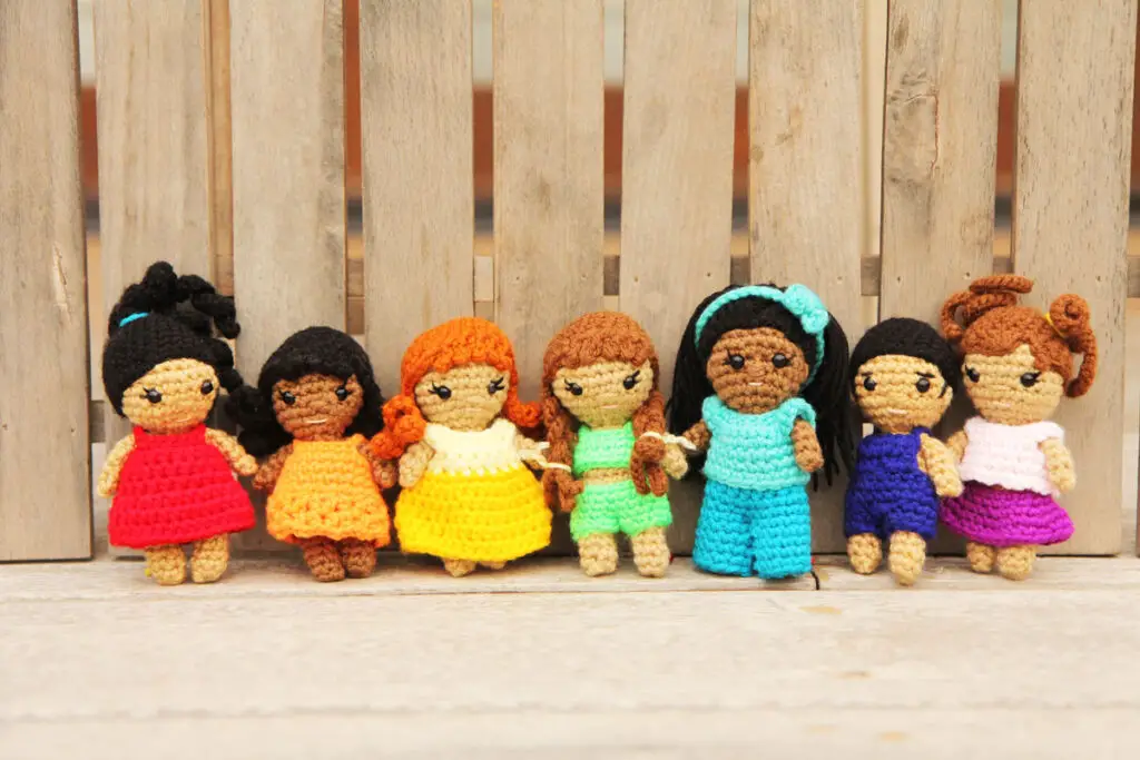 7 small crochet dress up dolls with removable clothes