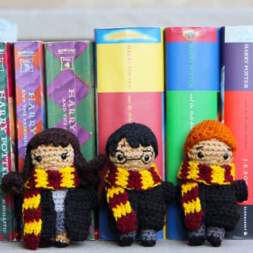 small crochet dolls of harry potter, hermione, and ron