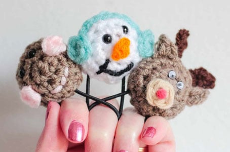 crochet Christmas ponytail holders with amigurumi gingerbread man, snowman, and reindeer