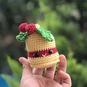 kawaii crochet christmas bell with holly on top