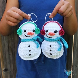 rag doll style snowman crochet ornaments with a scarf and mufflers