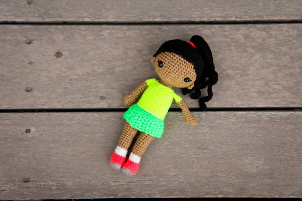 Cute Crochet doll with a lacy skirt and a high ponytail