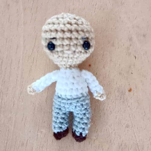 incomplete amigurumi groom doll with eyes inserted