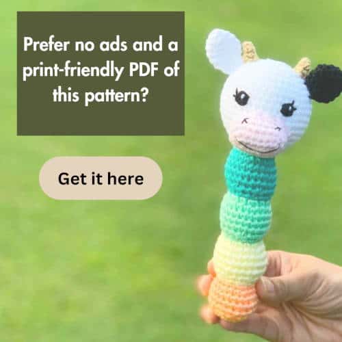 crochet cow rattle. Text overlay says: Prefer no ads and a print-friendly PDF of this pattern? Get it here
