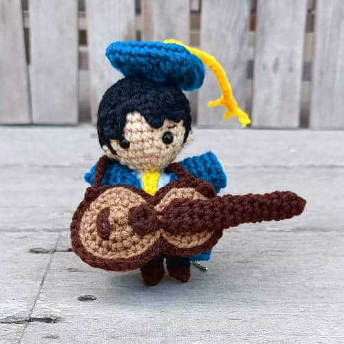 small crochet graduation doll with crochet guitar
