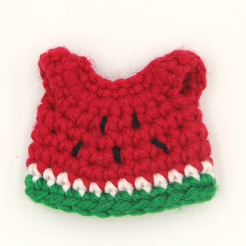 Crochet doll dress in the design of a watermelon