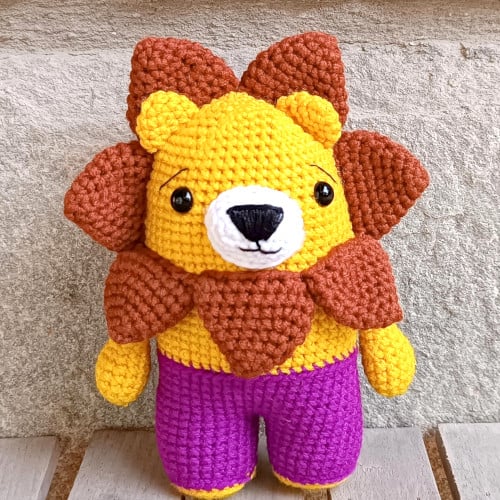 easy crochet lion with a sunflower man and purple pants