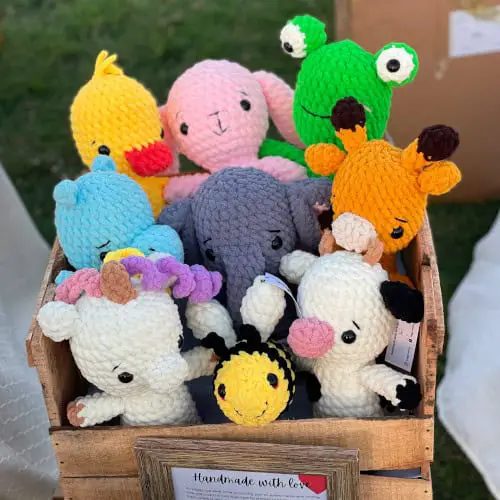 plush crochet animals at a craft show