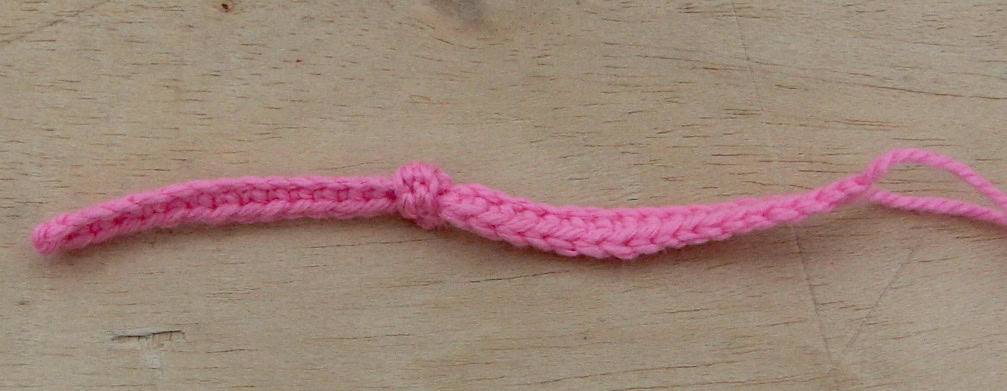 A long crochet strip for the hairband with a knot in between