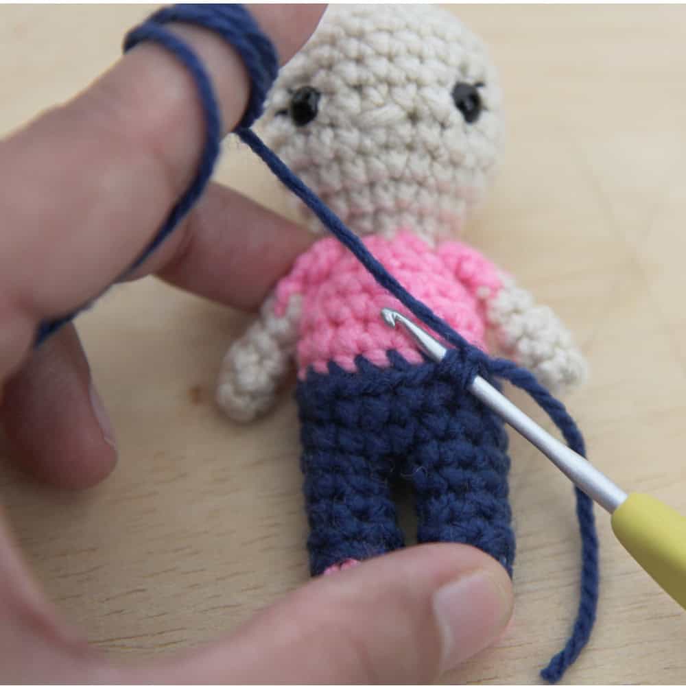 Hook inserted into the unworked stitches to make the overalls bib