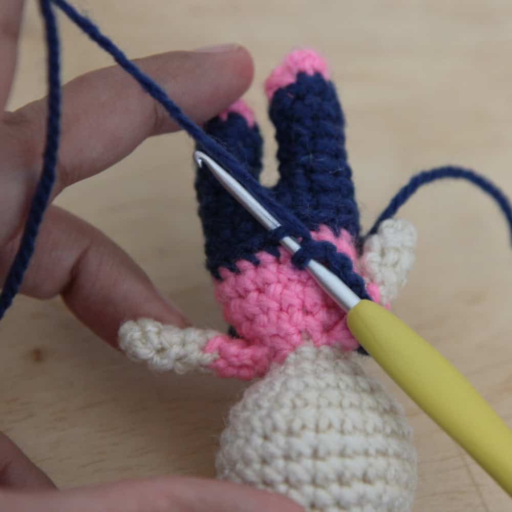 crochet hook inserted into the center back stitch